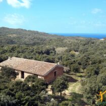 unfinished home set in mediterranean macchia in sardinia with coastal view