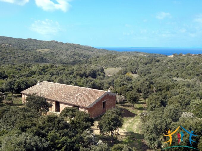 unfinished home set in mediterranean macchia in sardinia with coastal view