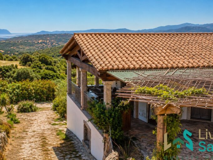side view of a sardinia country villa in sardinia overlooking the gulf of olbia across greenery as far as the isle of tavolara