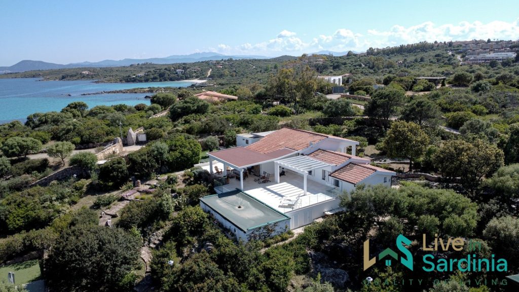 View on a sardinia villa with pool and garden facing the sea