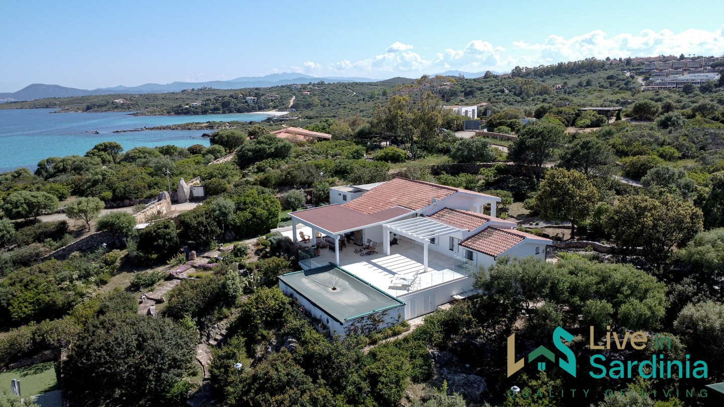 view on a sardinia villa with pool and garden facing the sea