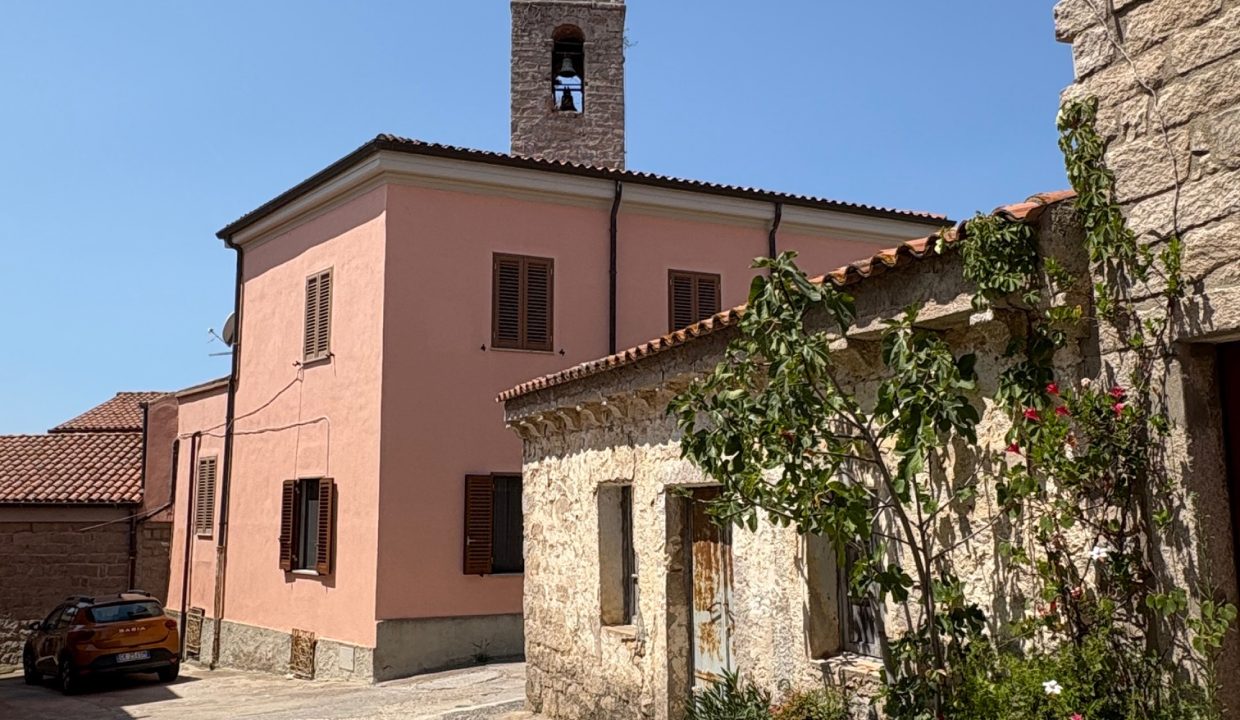 Historical center of a sardinian village and view on the church and old stone house