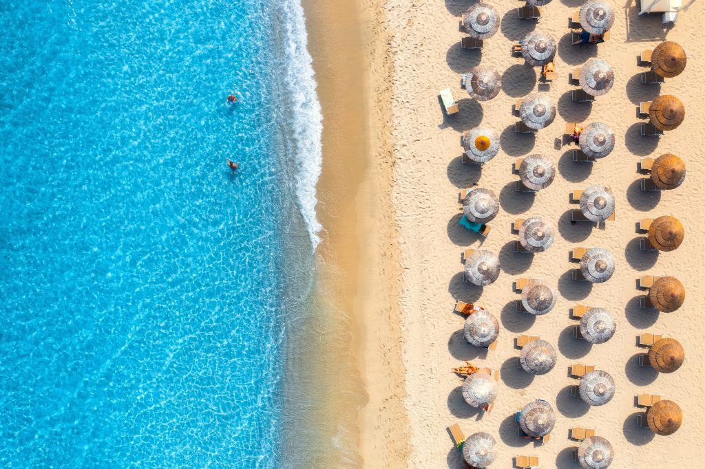 aerial view sardinia beach with umbrellas