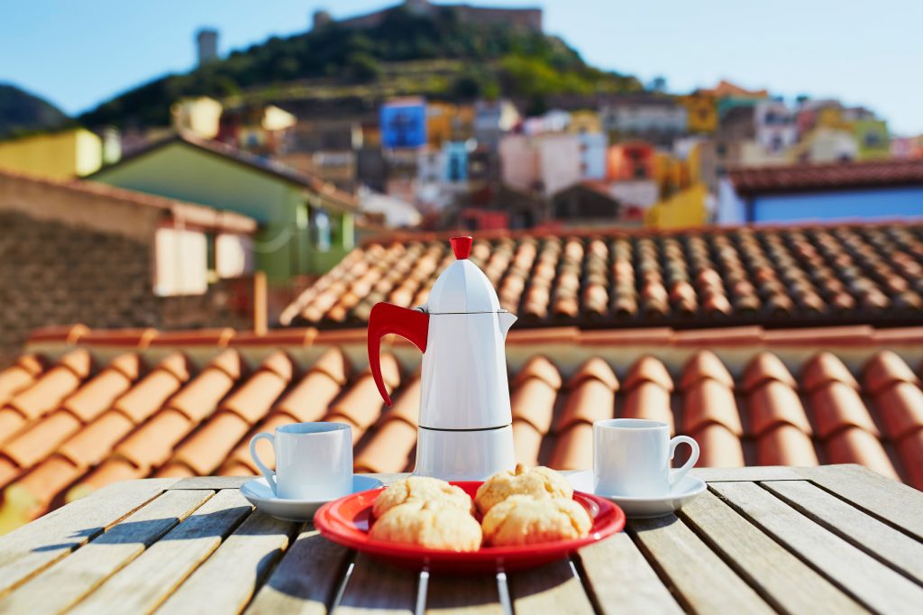 Coffee Machine and background with houses roof painted in various colours