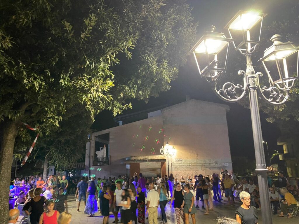 dancing in local piazza in telti during the myrtle festival
