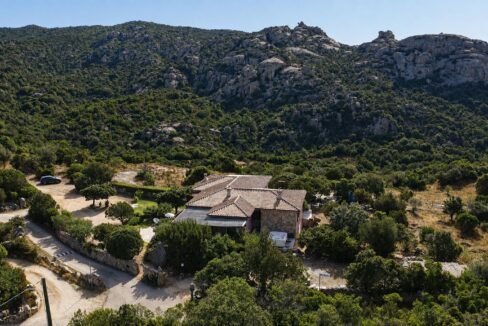 Aerial view of Villa Lu Lisandru surrounded by Gallura countryside and Mediterranean vegetation near Arzachena.
